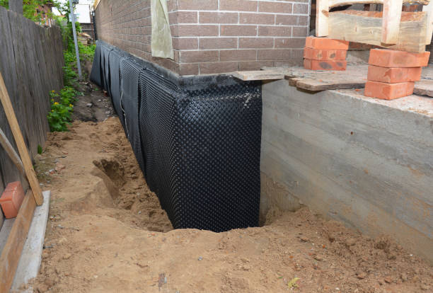 Happy homeowners after waterproofing job in District Heights